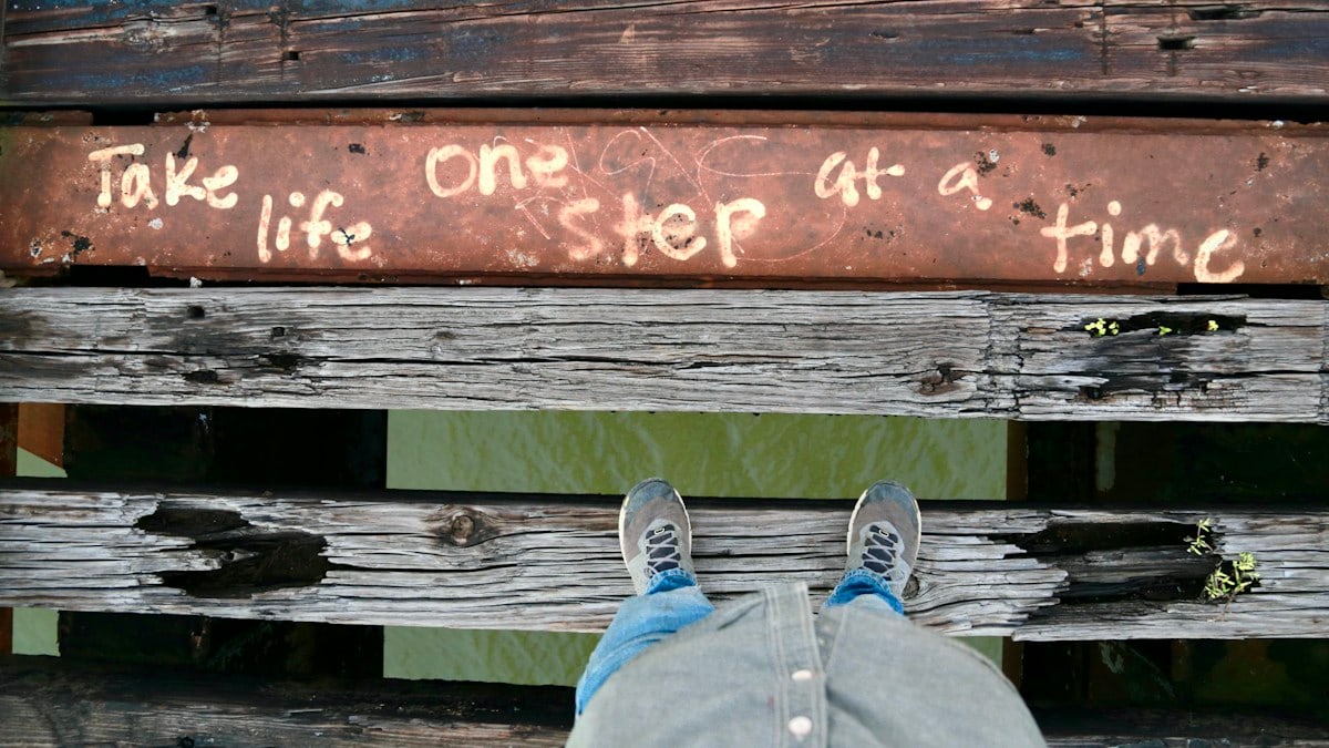 a person with their feet up on a bench